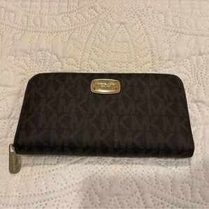Michael Kors Jet Set Travel continental zip-around wallet in the signature brown